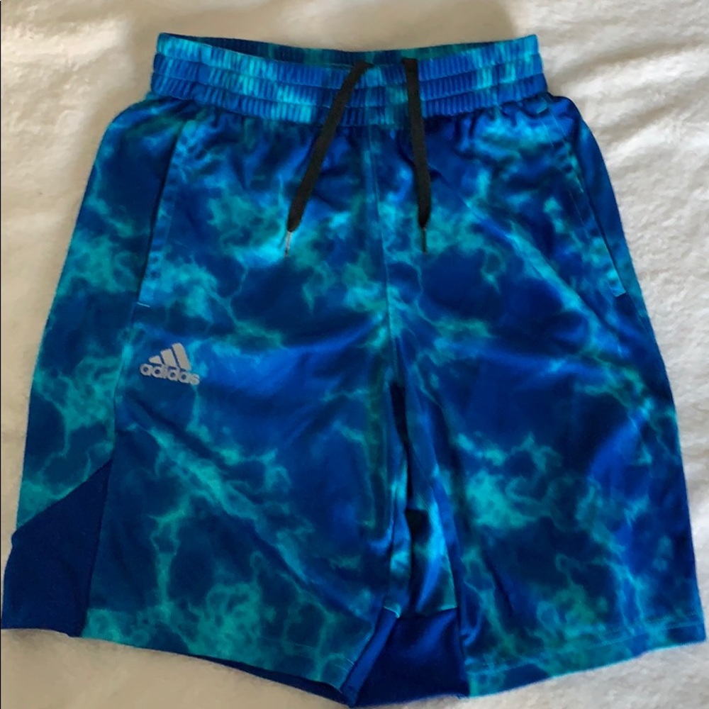 Blue adida shorts.